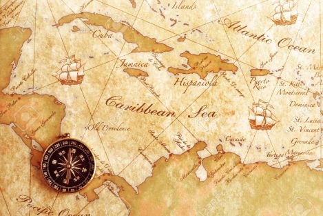 13573041-An-old-brass-compass-on-a-Treasure-map-background-Stock-Photo-map-nautical-history.jpg